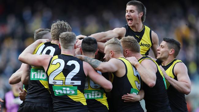 Marlion Pickett is mobbed by teammates after kicking a third quarter goal. Picture: Michael Klein.