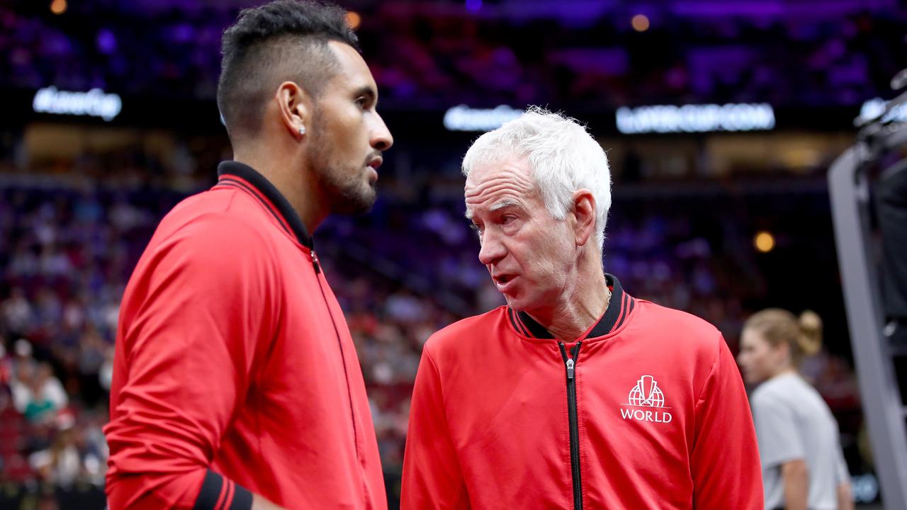 Nick Kyrgios of Australia and John McEnroe talk at the United Centre in Chicago.
