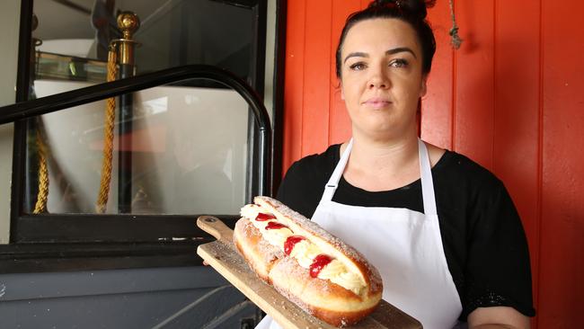 Kenilworth Country Bakery owner Jenna Sanders holding one of their famous 1kg Donuts. Photo Lachie Millard