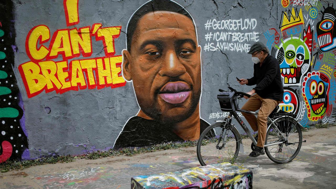 A Berlin artwork depicting a portrait of George Floyd, a black man who died in Minneapolis after a white policeman knelt on his neck for several minutes. Picture: David GANNON / AFP.