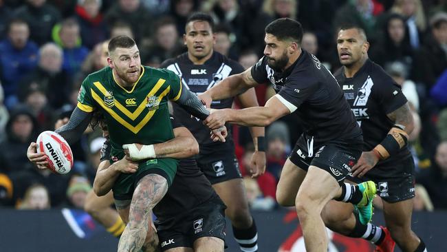 Australia's Josh Dugan and New Zealand's Jesse Bromwich in action during the final.