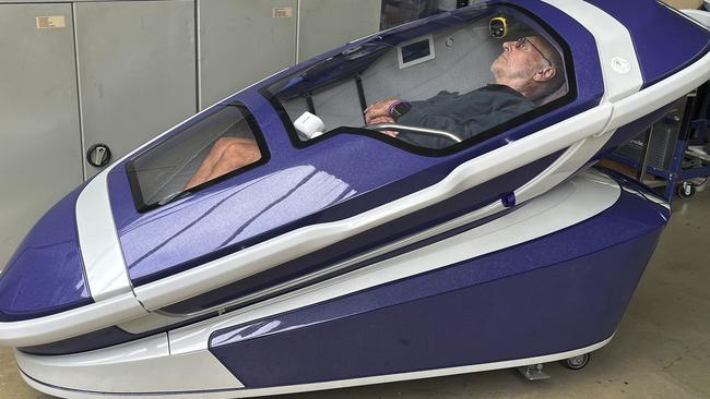 NETWORK SPECIAL. NO AUS, NO NEWS.COM , PLEASE CONTACT NETWORK PICTURE DESK BEFORE PUBLISHING.     ,  Philip Nitschke is seen inside a 'suicide pod' known as 'The Sarco' in Rotterdam, The Netherlands, July 8, 2024. (AP Photo/Ahmad Seir)