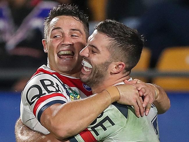 Cooper Cronk and James Tedesco of the Roosters  can expect to be celebrating again this weekend if the punters are right. Picture: AAP Image/David Rowland