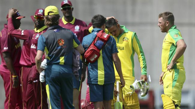 The Aussie medical staff rush out to check on the wellbeing of Usman Khawaja.