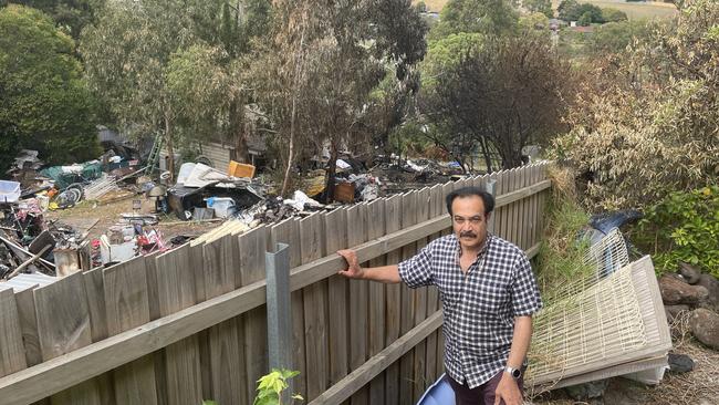 Ahmed El-Gadaa had his fence and garden damaged following a fire on an empty block on Struan Ave, Mooroolbark on February 27. Picture: Kiel Egging.