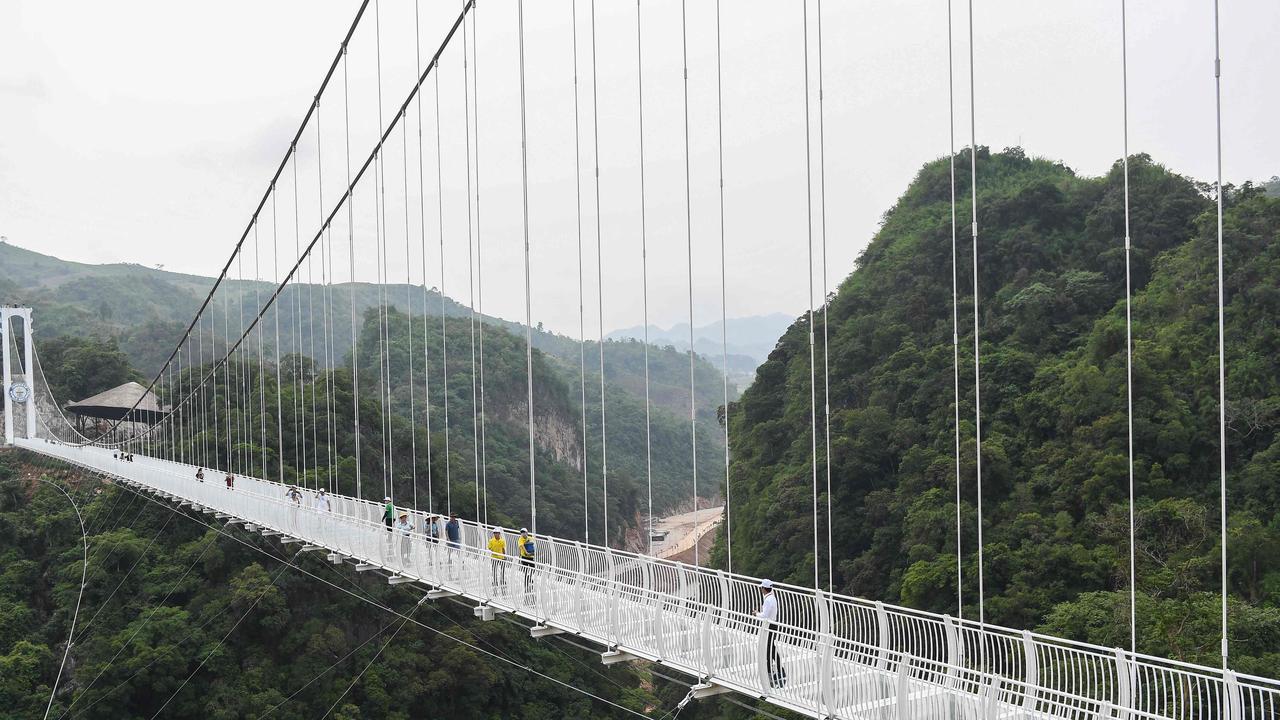 Visitors were quick to walk across the newly opened bridge on Friday. Tourism officials hope international visitors will be just as enthusiastic about the new attraction. Picture: Nhac Nguyen/AFP