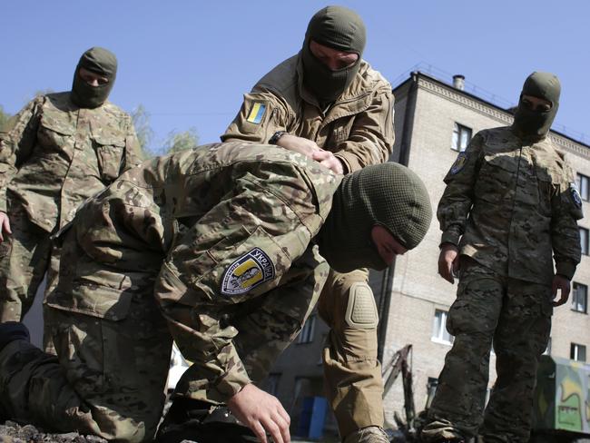 Training ... Sich-1 battalion servicemen take part in a training session on their base in Slavyansk. Picture: AFP
