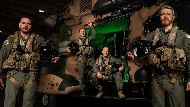 Disaster “high readiness” vessel HMAS Adelaide and its crack MRH-90 helicopter flight crew Lieutenant Joshua Callan, Leading Seaman Aircrewman Thomas Hill, Petty Officer Aircrewman Karl Beyer and Lieutenant Michael Regan, on permanent standby for disaster and humanitarian relief. Picture: Defence