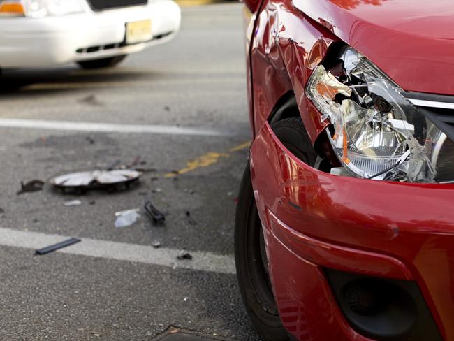 Red Car in an Accident. Image Detail with Selective Focus.