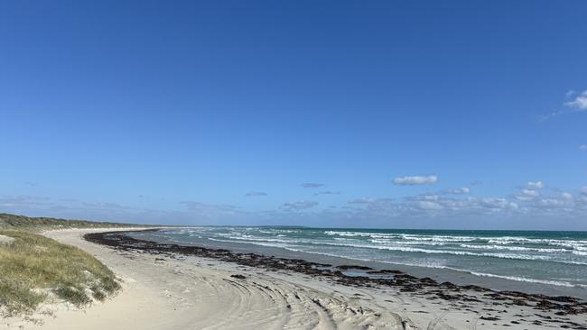 The beach where two men lost their lives. A woman has been taken to hospital.