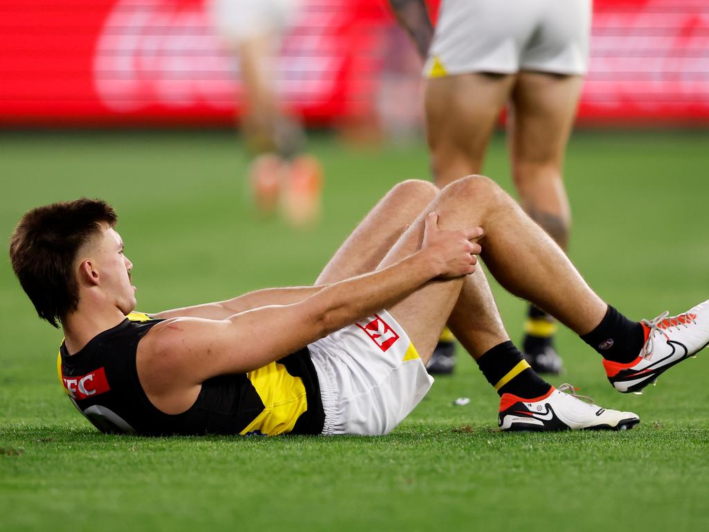 Josh Gibcus after hurting his knee on Thursday night. Picture: Dylan Burns/AFL Photos via Getty Images)