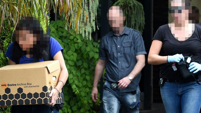 Evidence is taken by IBAC officers during a raid in Kelior East. Picture: Nicole Garmston