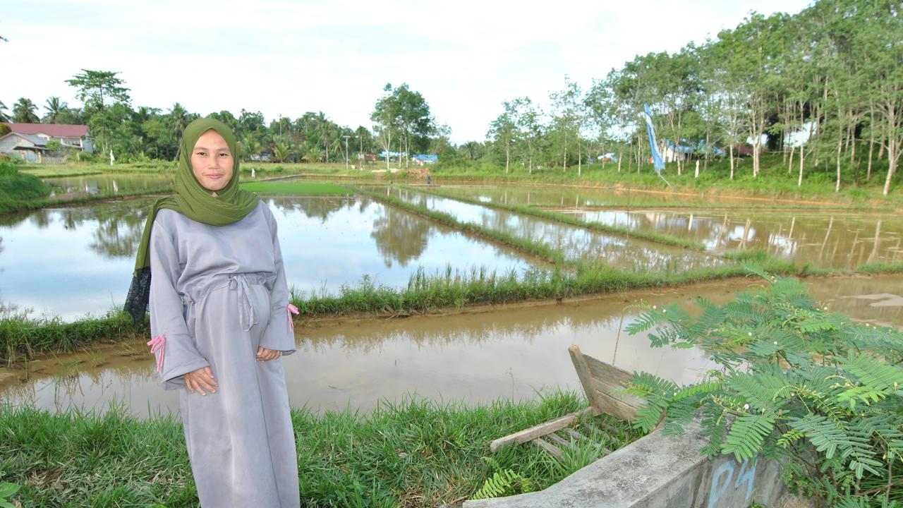 Yati Dahlia, a traditional dancer, at her house in Bumi Harapan, close to the core development region of Indonesia’s new capital city.