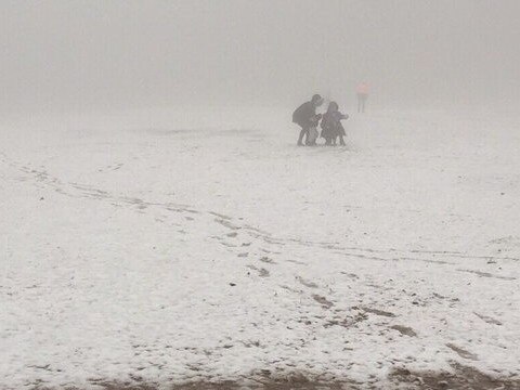 Snow falls at Olinda Football Club's home ground. Twitter: OFCFNC