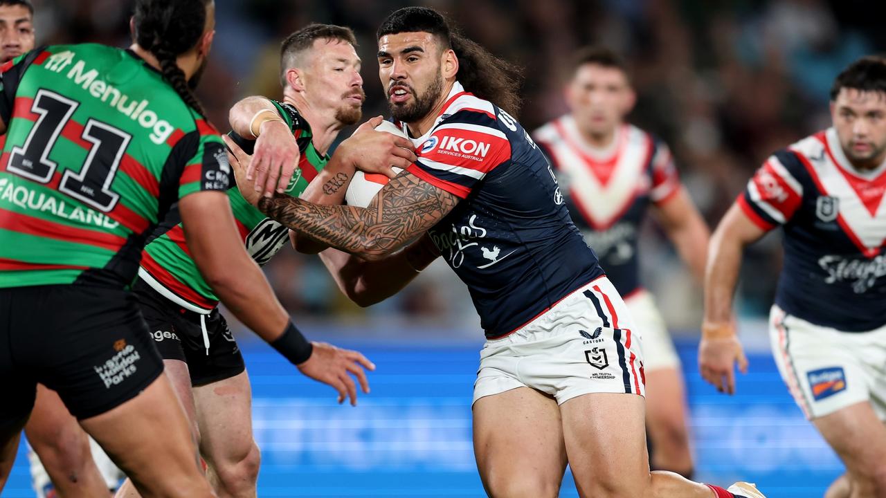 SYDNEY, AUSTRALIA - SEPTEMBER 01: Terrell May of the Roosters is tackled during the round 27 NRL match between South Sydney Rabbitohs and Sydney Roosters at Accor Stadium on September 01, 2023 in Sydney, Australia. (Photo by Matt King/Getty Images)