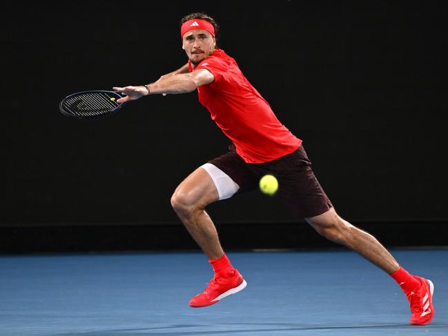 MELBOURNE, AUSTRALIA - JANUARY 12: Alexander Zverev of Germany plays a forehand against Lucas Pouille of France in the Men's Singles First Round match during day one of the 2025 Australian Open at Melbourne Park on January 12, 2025 in Melbourne, Australia. (Photo by Hannah Peters/Getty Images)