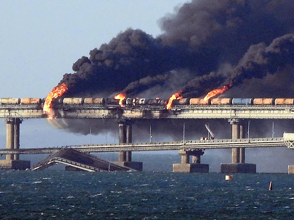 Black smoke billows from a fire on the Kerch bridge that links Crimea to Russia, after a truck exploded. Picture: AFP