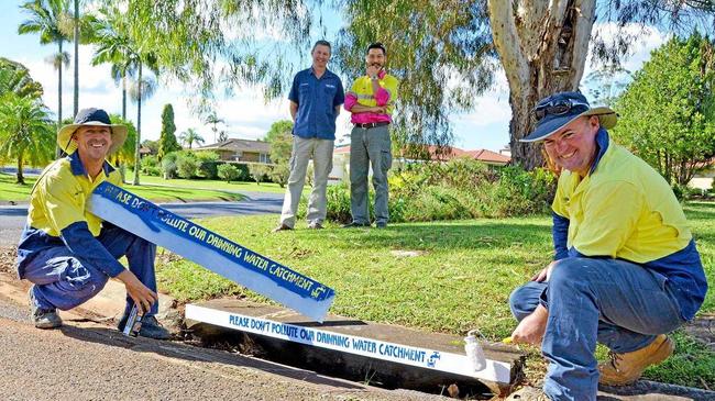 Installing new stormwater stencils in Goonellabah this week were Lismore City Council signs and line marking leading hand Neil Whiteman and skilled labourer Steve Murada (front) with Rous Water catchment assets manager Anthony Acret and Lismore City Council environmental strategies officer Anton Nguyen.