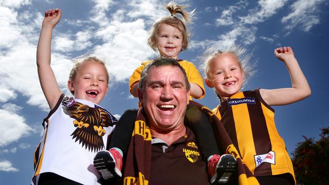 Former Port Adelaide Magpies player Greg Phillips with his grandchildren Ashlee, Chloe and Jemma wearing Hawthorn colours in support of Shaun Burgoyne ahead of Hawthorn’s 2013 grand final win. Picture: Sarah Reed