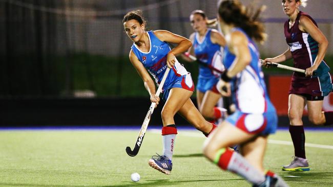 Action from the Cairns Hockey A Grade Women's match between the Cairns Saints and Brothers. Saints' Liv McArthur finds support as she runs the ball down the middle. PICTURE: BRENDAN RADKE