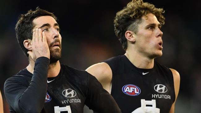 Kade Simpson and Charlie Curnow after the loss to the Bulldogs.