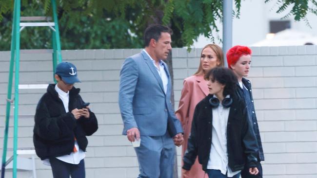 ONE TIME WEB USE FOR NEWS.COM.AU ONLY - FEES APPLY -  AU_2938109 - Los Angeles, CA  -  *PREMIUM-EXCLUSIVE*  - Ben Affleck and Jennifer Lopez briefly hold hands while leaving his daughter Violet's high school graduation ceremony. The couple, who are currently living apart, looked very tense as they walked out with her kids Max and Emme, and his kids Fin and Sam. Also along was Ben's mom, Chris Affleck, and Jennifer Garner's mom, Pat Garner. Ben and JLo left separately, each with their own kids,  and returned to their own homes. Shot 5/30/24  Pictured: Ben Affleck, Jennifer Lopez  BACKGRID Australia 31 MAY 2024   Phone: + 61 419 847 429 Email:  sarah@backgrid.com.au