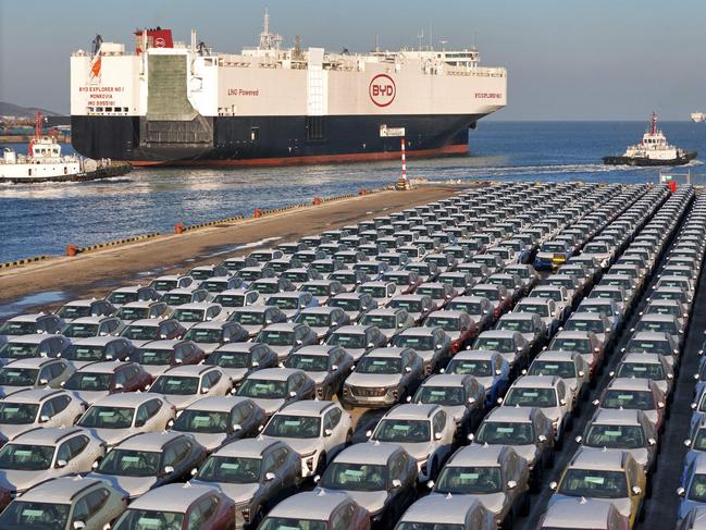 (FILES) This file photo taken on January 10, 2024 shows electric cars for export waiting to be loaded on the "BYD Explorer NO.1", a domestically manufactured vessel intended to export Chinese automobiles, at Yantai port, in eastern China's Shandong province. China overtook Japan as the world's biggest vehicle exporter last year, data from the Japan Automobile Manufacturers Association (JAMA) showed on January 31, 2024. (Photo by AFP) / China OUT