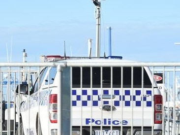 Police on scene at the Portarlington Pier. Picture: David Smith