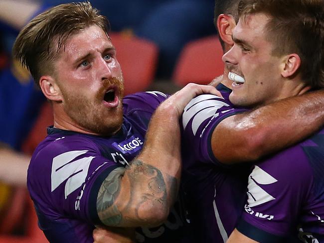 BRISBANE, AUSTRALIA - OCTOBER 03: Cameron Munster and Ryan Papenhuyzen of the Storm celebrate a try during the NRL Qualifying Final match between the Melbourne Storm and the Parramatta Eels at Suncorp Stadium on October 03, 2020 in Brisbane, Australia. (Photo by Jono Searle/Getty Images)