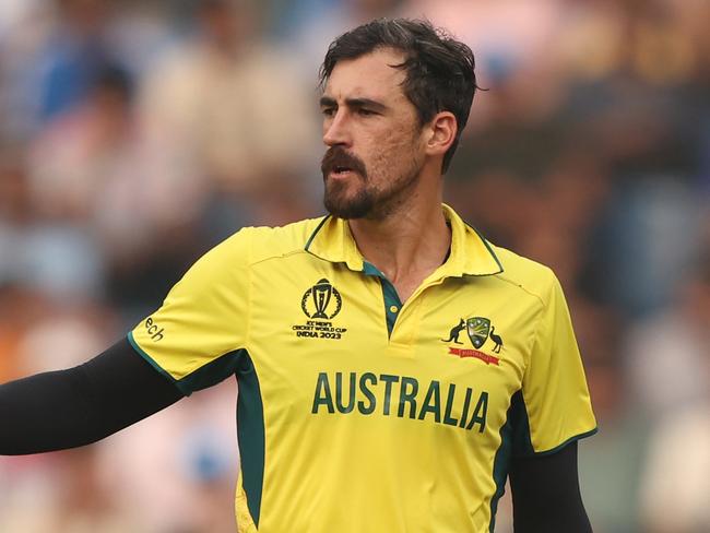 MUMBAI, INDIA - NOVEMBER 07: Mitchell Starc of Australia celebrates the wicket of Hashmatullah Shahidi of Afghanistan during the ICC Men's Cricket World Cup India 2023 between Australia and Afghanistan at Wankhede Stadium on November 07, 2023 in Mumbai, India. (Photo by Robert Cianflone/Getty Images)