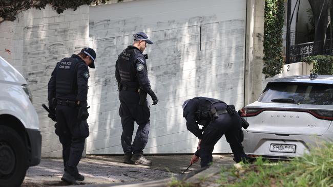 Police do a line search on the street at the scene. Firebombing in Magney Street Woollahra. Picture: Rohan Kelly