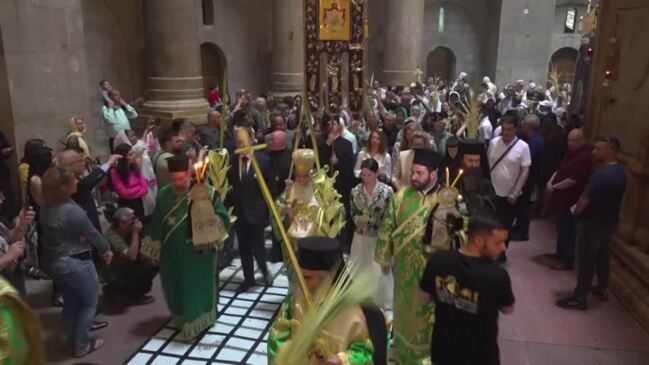 Greek Orthodox patriarch leads Palm Sunday procession in Jerusalem