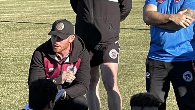 Coach Freeman delivers his halftime address to Marsden SHS.