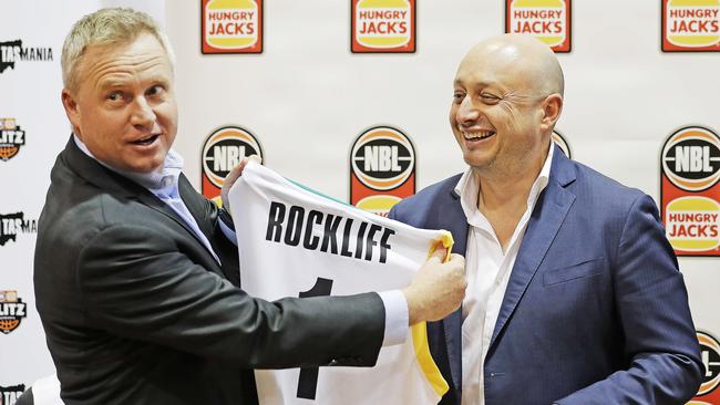 Sport and Recreation Minister Jeremy Rockliff receives a jersey from NBL owner Larry Kestelman who announced that the NBL Blitz will be heading to Tasmania in September. Picture: ZAK SIMMONDS