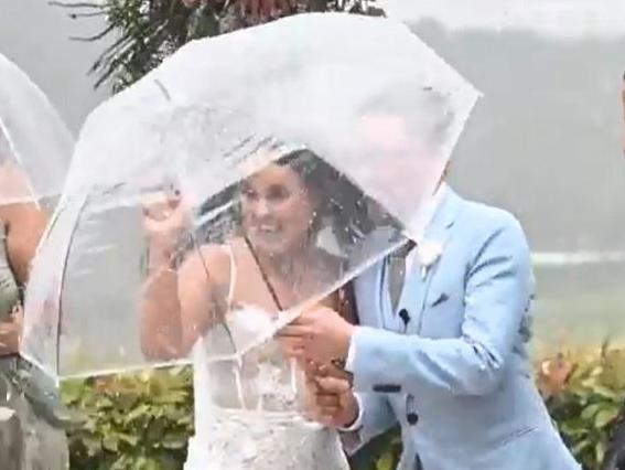 Adele & Bradley Foster were caught up in the mini cyclone during their wedding ceremony at Maximilians in Verdun in the Adelaide Hills today. Picture: Sam Dalton - SkyPix Productions (please credit)