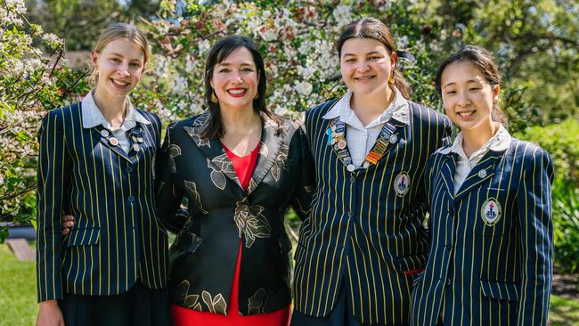 Outgoing Ravenswood principal Anne Johnstone (second from left) with students. Picture: Supplied