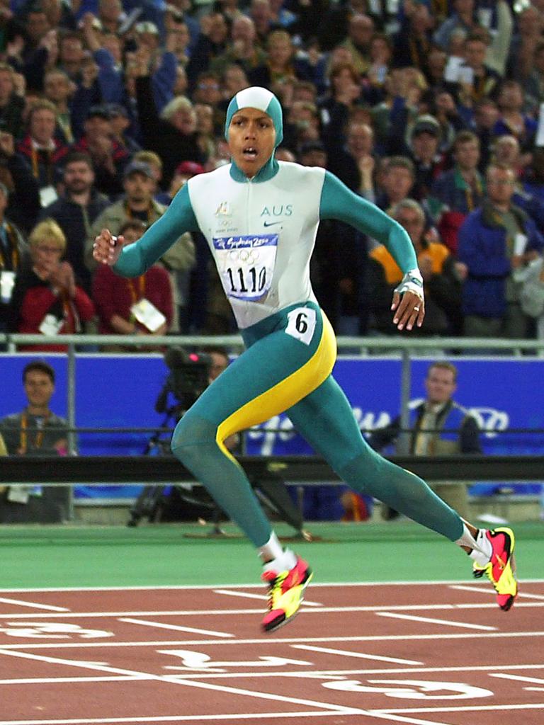 Cathy Freeman crosses the finish line to win the 400m final, cheered on by a jubilant crowd at the Sydney Olympic Games. Picture: AFP