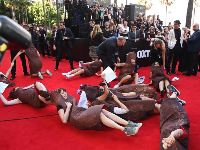 Security had to remove the women who laid on the carpet. Picture: Richard Dobson