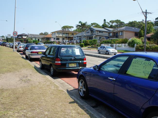 Cars are parked for sale in the southbound bus lane on Pittwater Rd, Collaroy and Long Reef from Friday night to Sunday night at the unofficial weekend car market that’s been operating for at least 30 years. Picture: Supplied