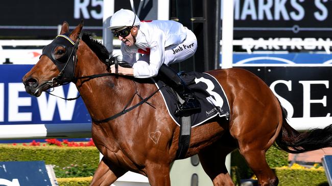 Jockey Joshua Parr, riding Deploy to win race 5, in the Theo Marks Stakes, during the Run To The Rose Day at Rosehill Garden in Sydney, Saturday, Sept. 9, 2017.(AAP Image/Brendan Esposito) NO ARCHIVING