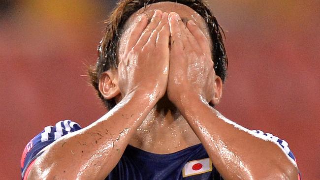Japan’s Hiroshi Kiyotake reacts after another missed chance during the game against Iraq.