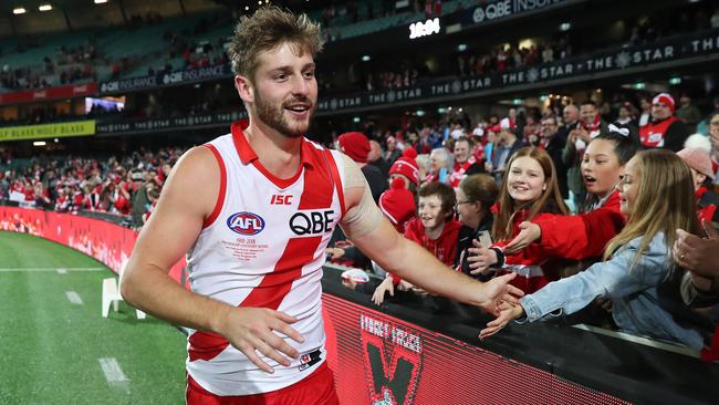 Alex Johnson celebrates with fans in his return game. Picture: Phil Hillyard