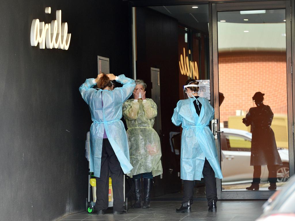 Victoria Health personnel coming in to clean the Ariele Apartments, where residents have been instructed not to leave the building due to a Covid outbreak. Picture: NCA NewsWire / Nicki Connolly