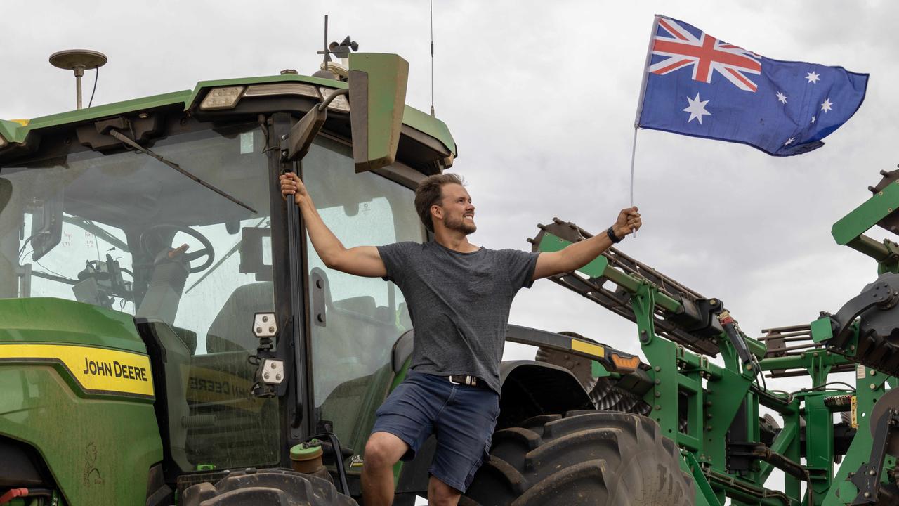 Harry Schuster flying the Australian flag. Picture: Kelly Barnes