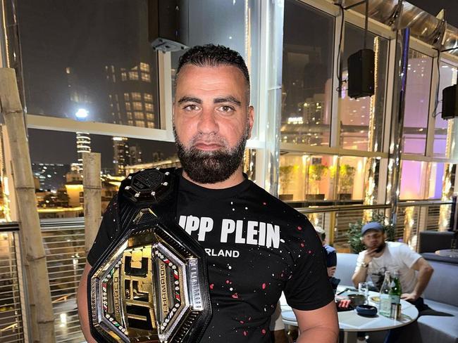 Sefton gym shooting victim Taha Sabbagh poses with the UFC belt.