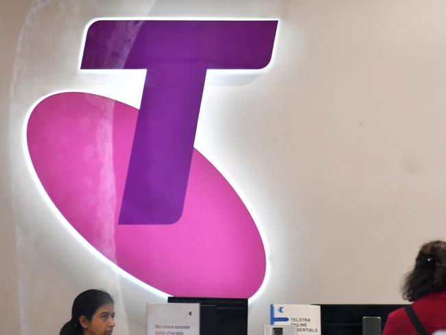 Customers and assistants are seen in a Telstra store in Sydney, Monday, July 8, 2018. Investors hoping to maintain their dividend payments from Telstra might be in for a shock, with Plato Investment Management managing director Don Hanson warning the rivers of gold are over for the telecommunications company. (AAP Image/Mick Tsikas) NO ARCHIVING