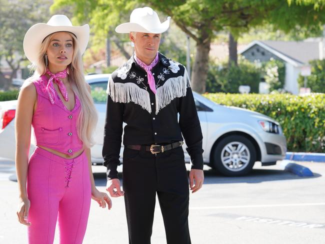 Margot Robbie as Barbie with co-star Ryan Gosling in the Barbie movie.