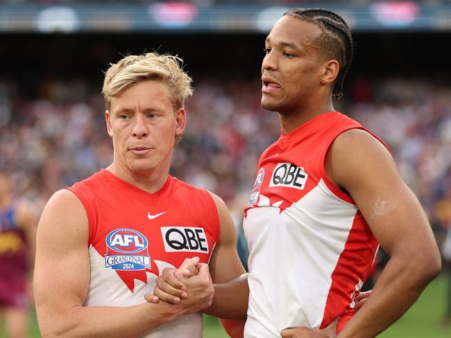 A disappointed Heeney with Joel Amartey. Picture: Robert Cianflone/AFL Photos via Getty Images