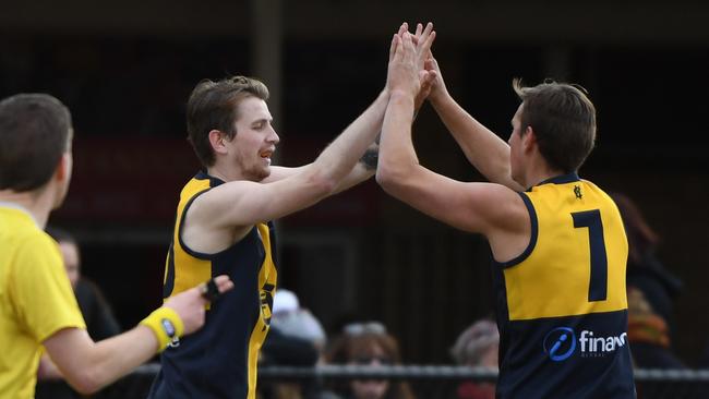 Happy days at Hurstbridge after it dodged relegation with a last-round victory over Whittlesea. Picture: James Ross.