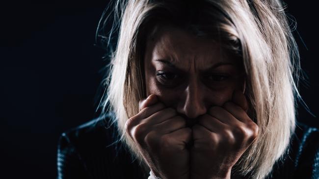 scared woman domestic violence generic